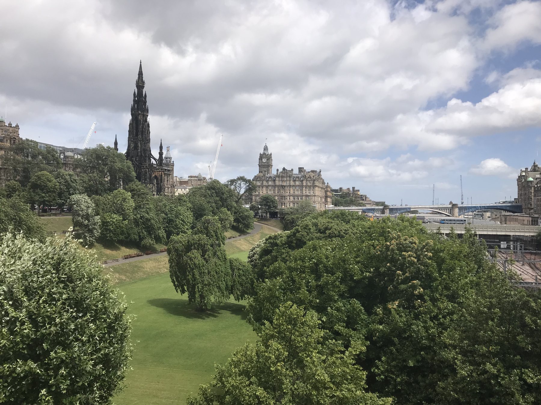 Princes Street Gardens beneath Edinburgh’s historic skyline and the Scott Monument