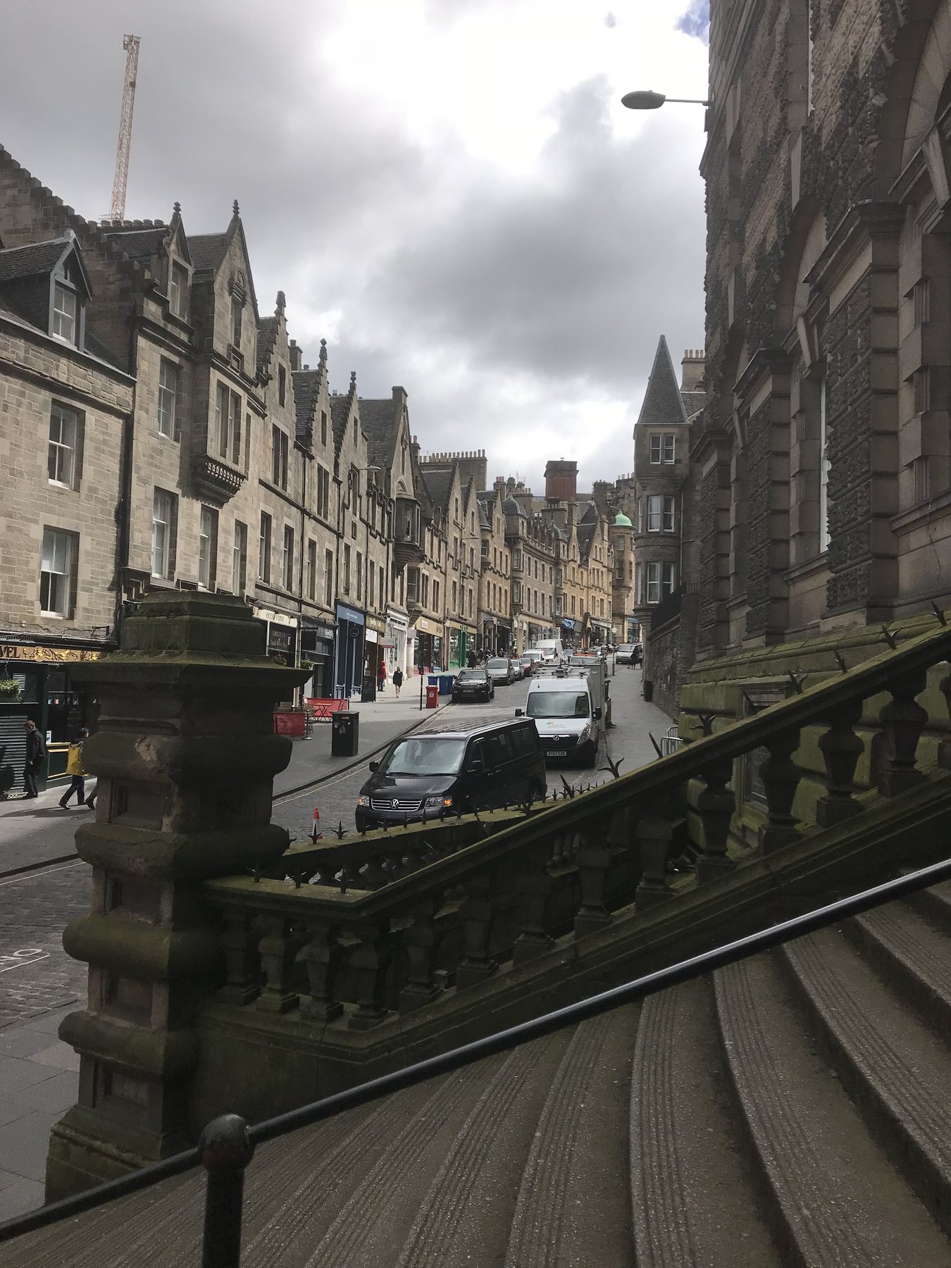 Historic stone buildings lining a busy street in Edinburgh’s Old Town