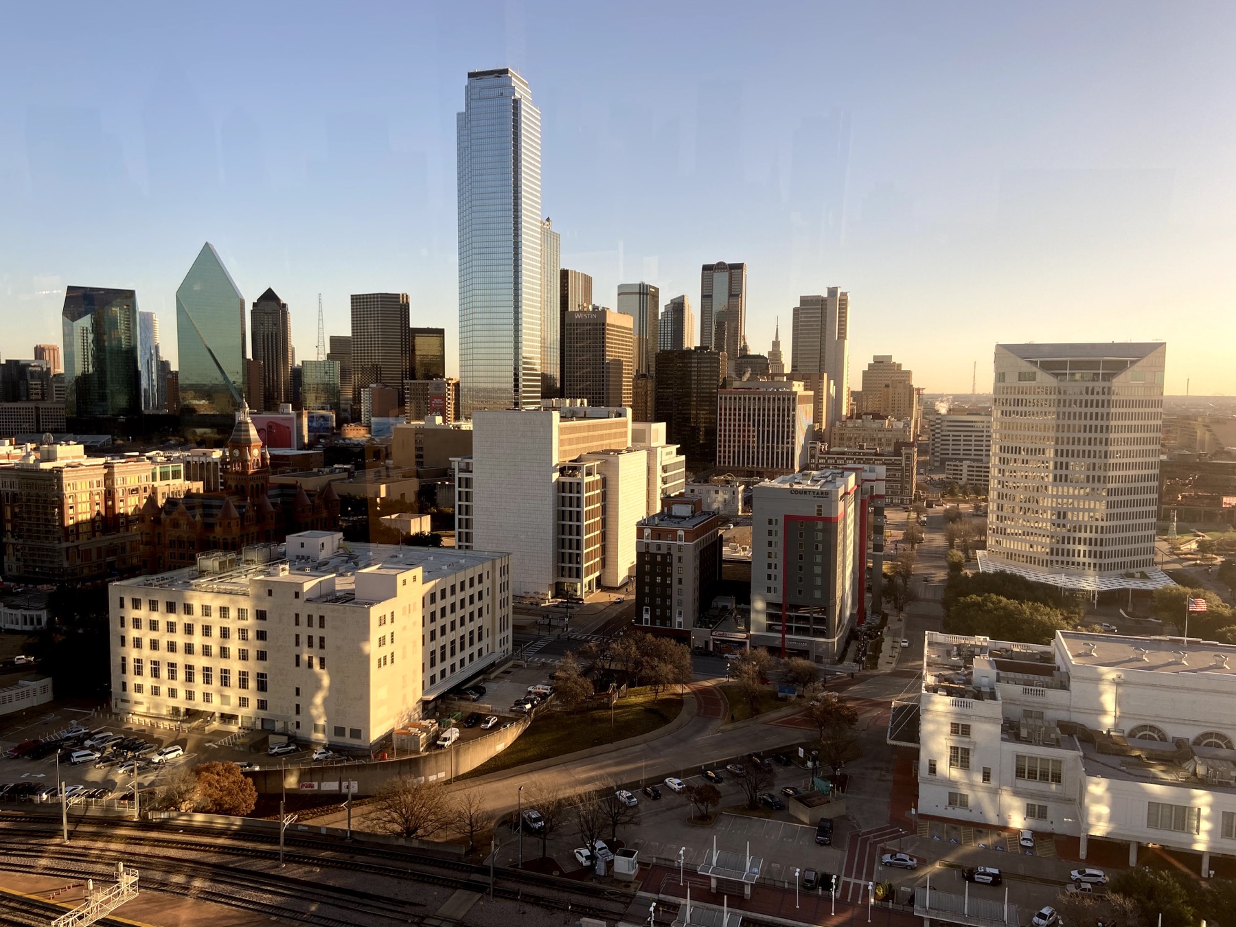 Downtown Dallas skyline glowing in the late-afternoon sun