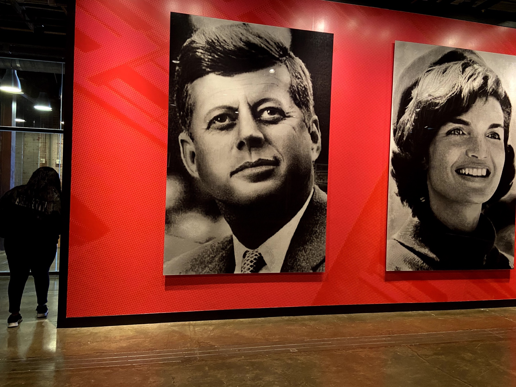 Large portraits of President John F. Kennedy and Jacqueline Kennedy inside The Sixth Floor Museum