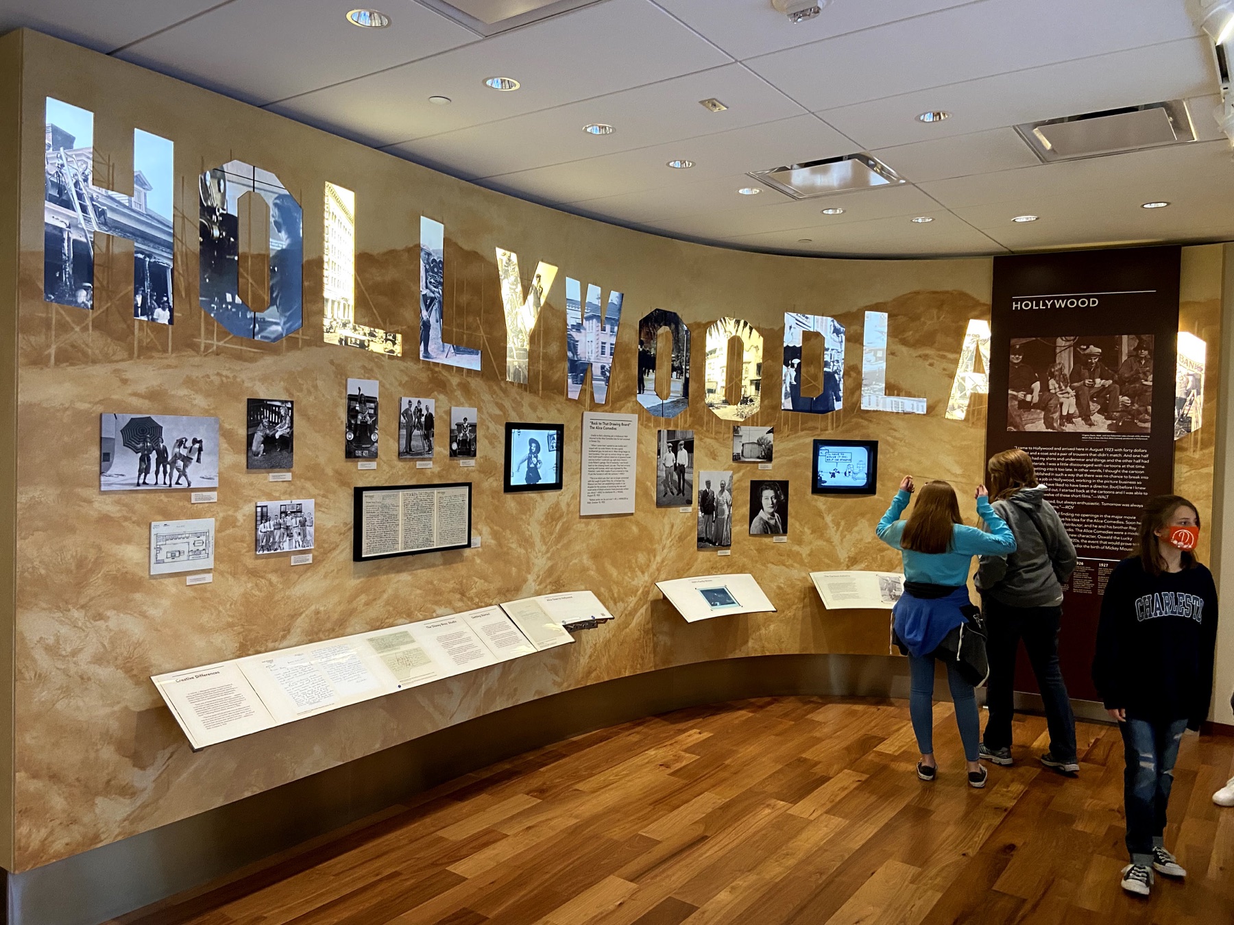 The Schmitt family exploring the Hollywood gallery at The Walt Disney Family Museum