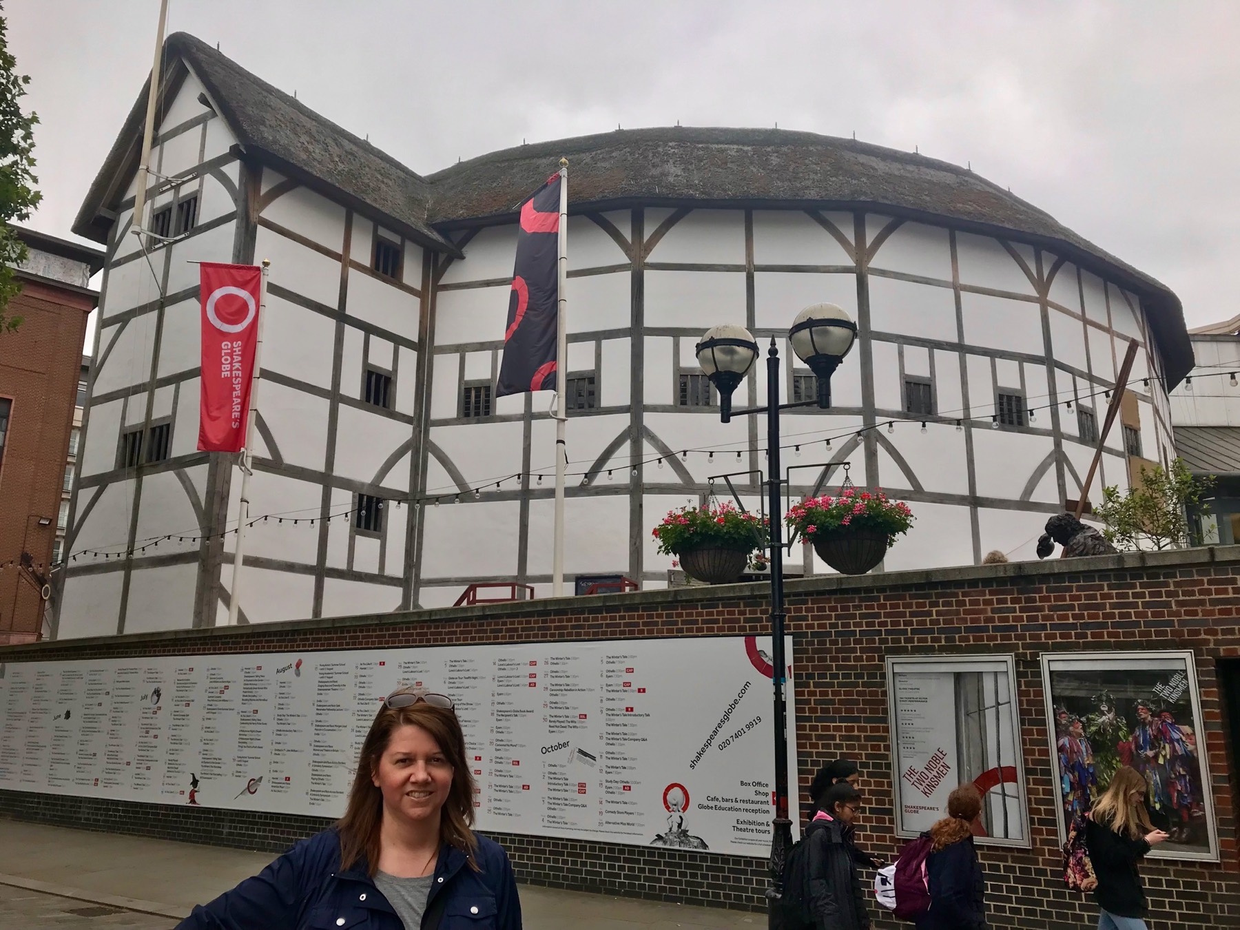 Angela standing outside the timber-framed reconstruction of Shakespeare’s Globe