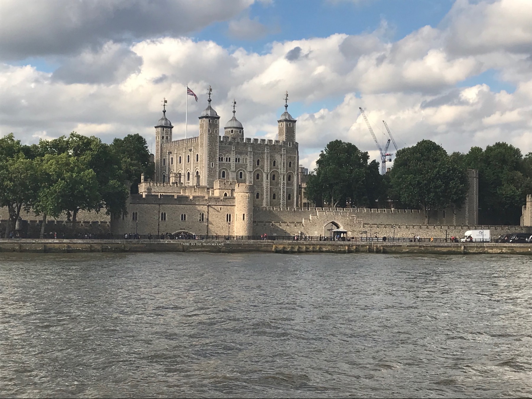 The White Tower and outer walls of the Tower of London viewed from the River Thames