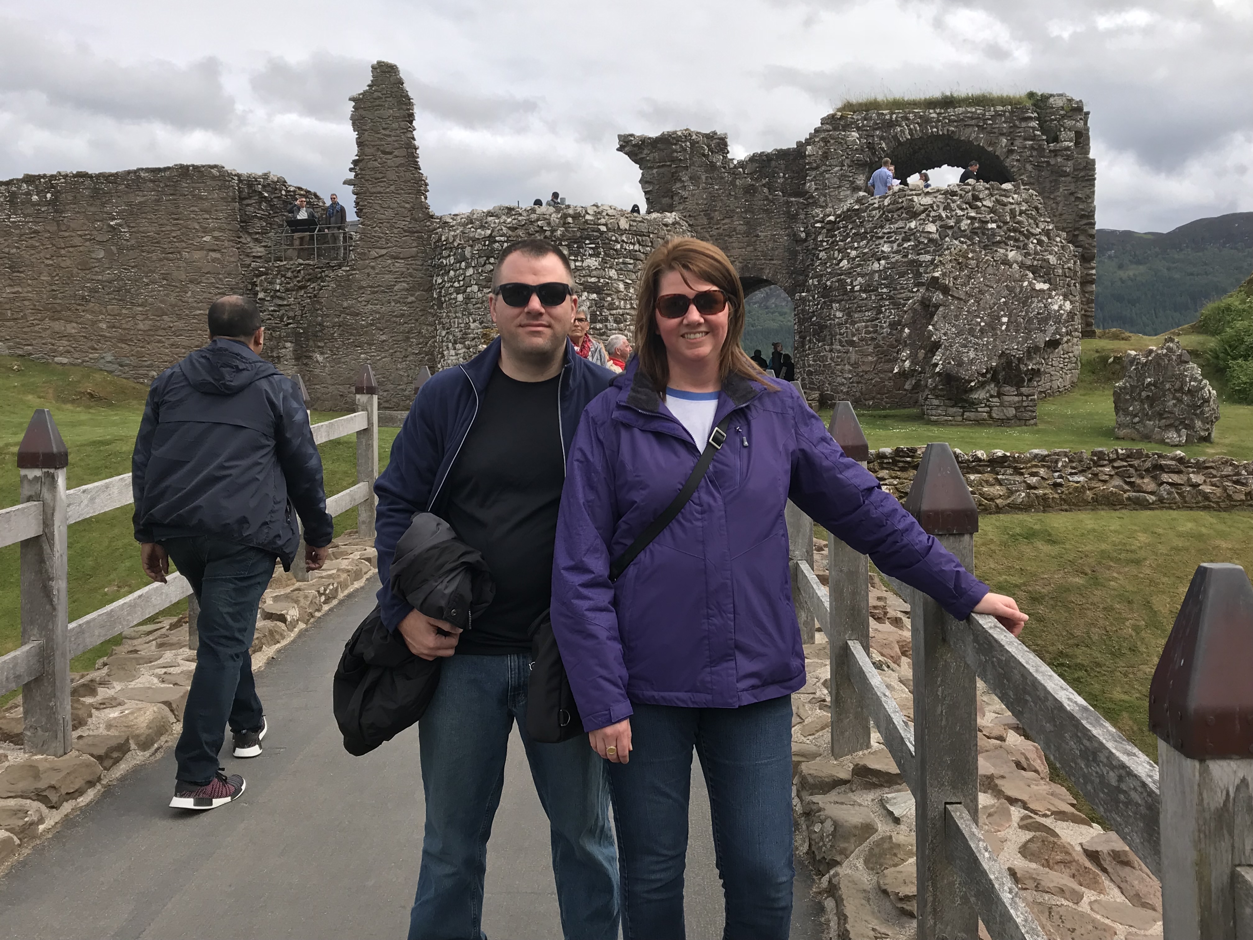 Angela and her husband in front of the ruins of Urquhart Castle