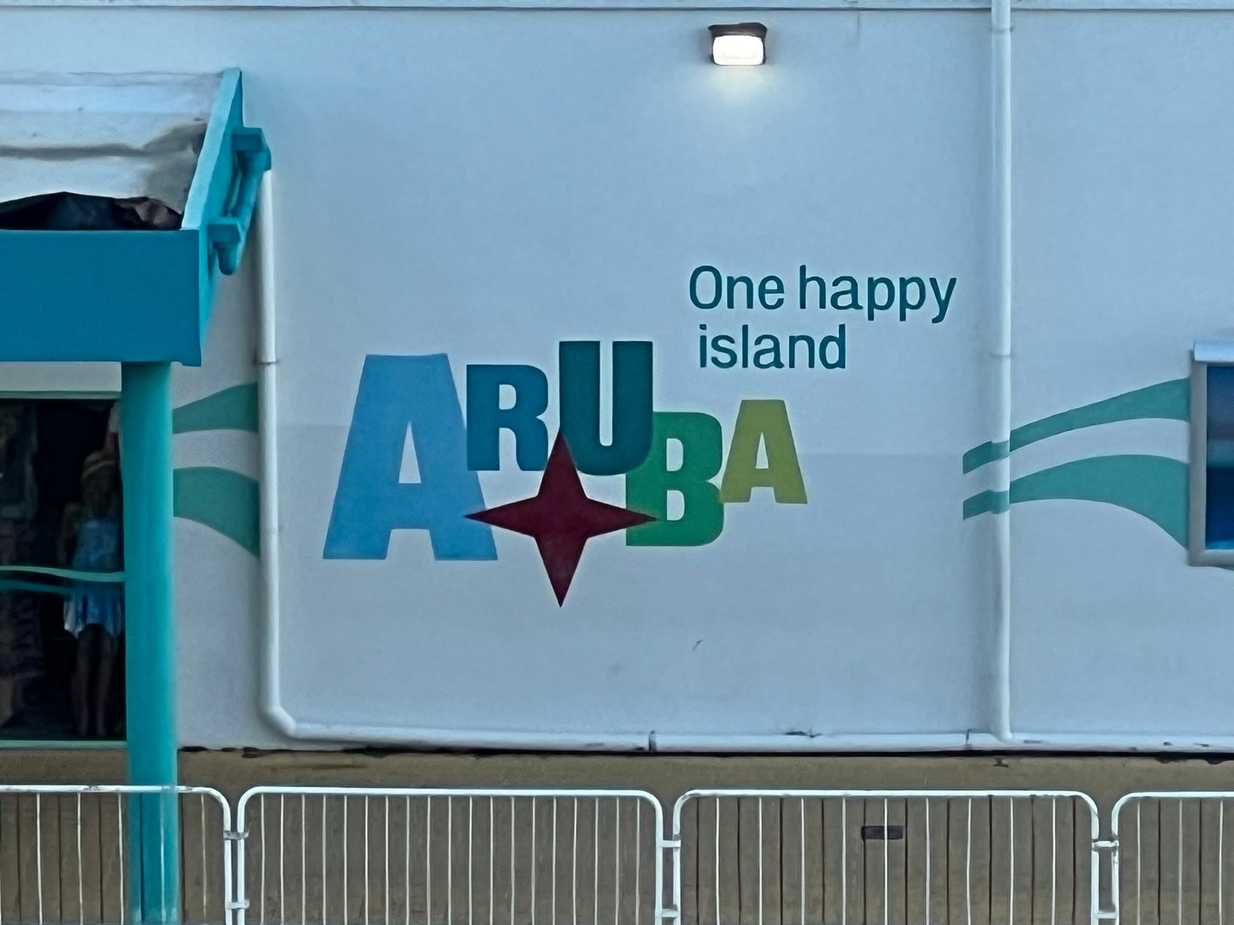 One happy island Aruba sign at the Oranjestad cruise terminal