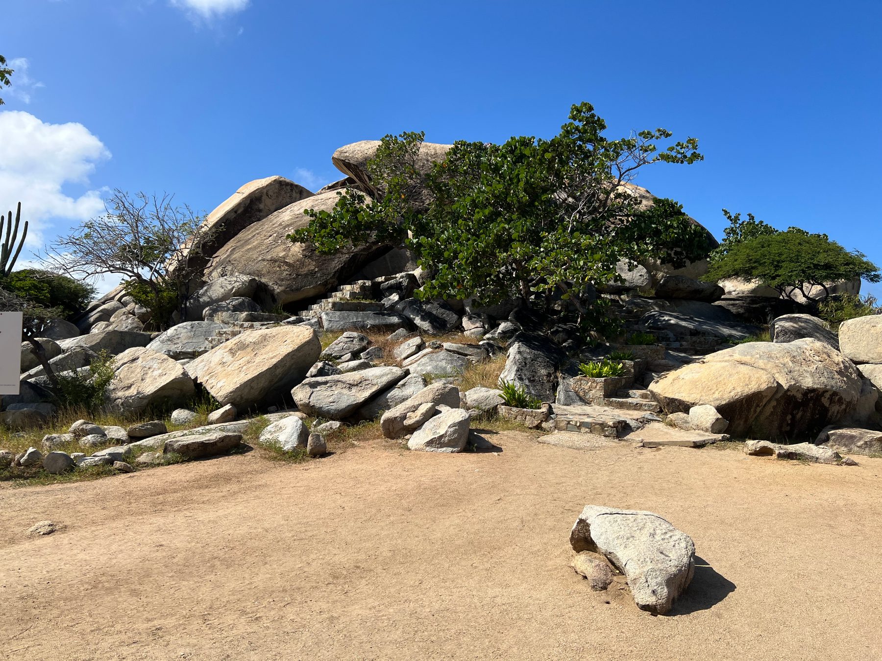 Stone steps leading among large boulders and cactus at Casibari Rock Formations in Aruba