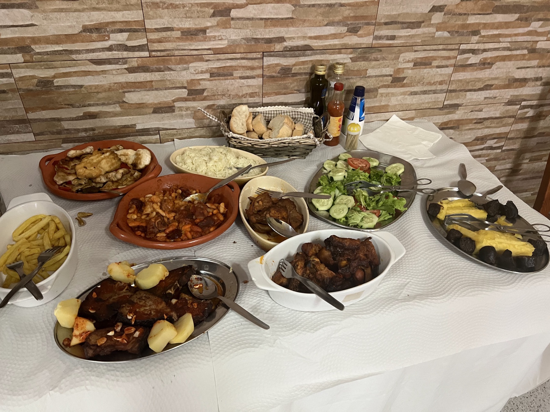 Table set with several platters of a traditional Azorean lunch