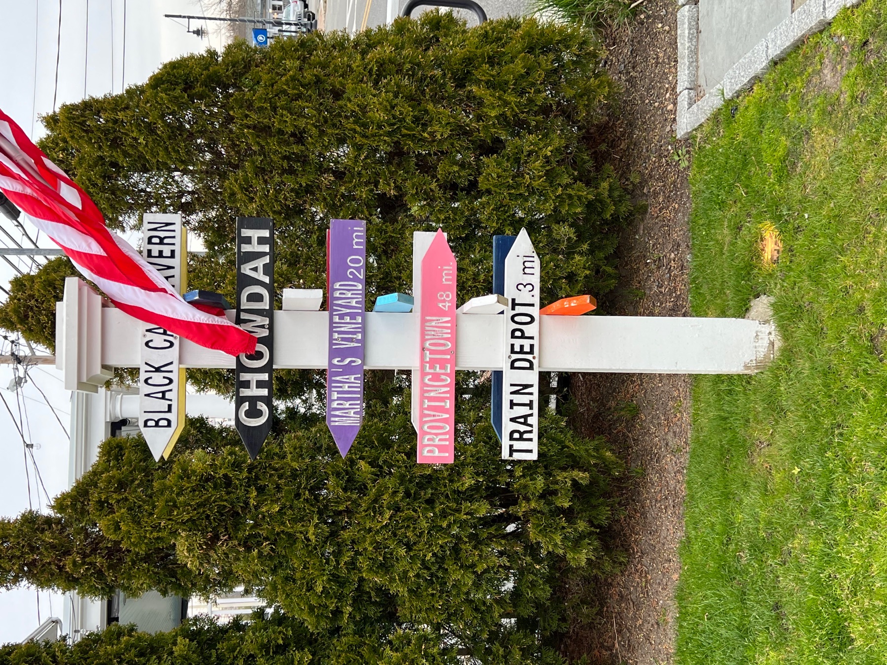 Signpost in Hyannis pointing toward Chatham, Martha’s Vineyard, Provincetown, and the train depot