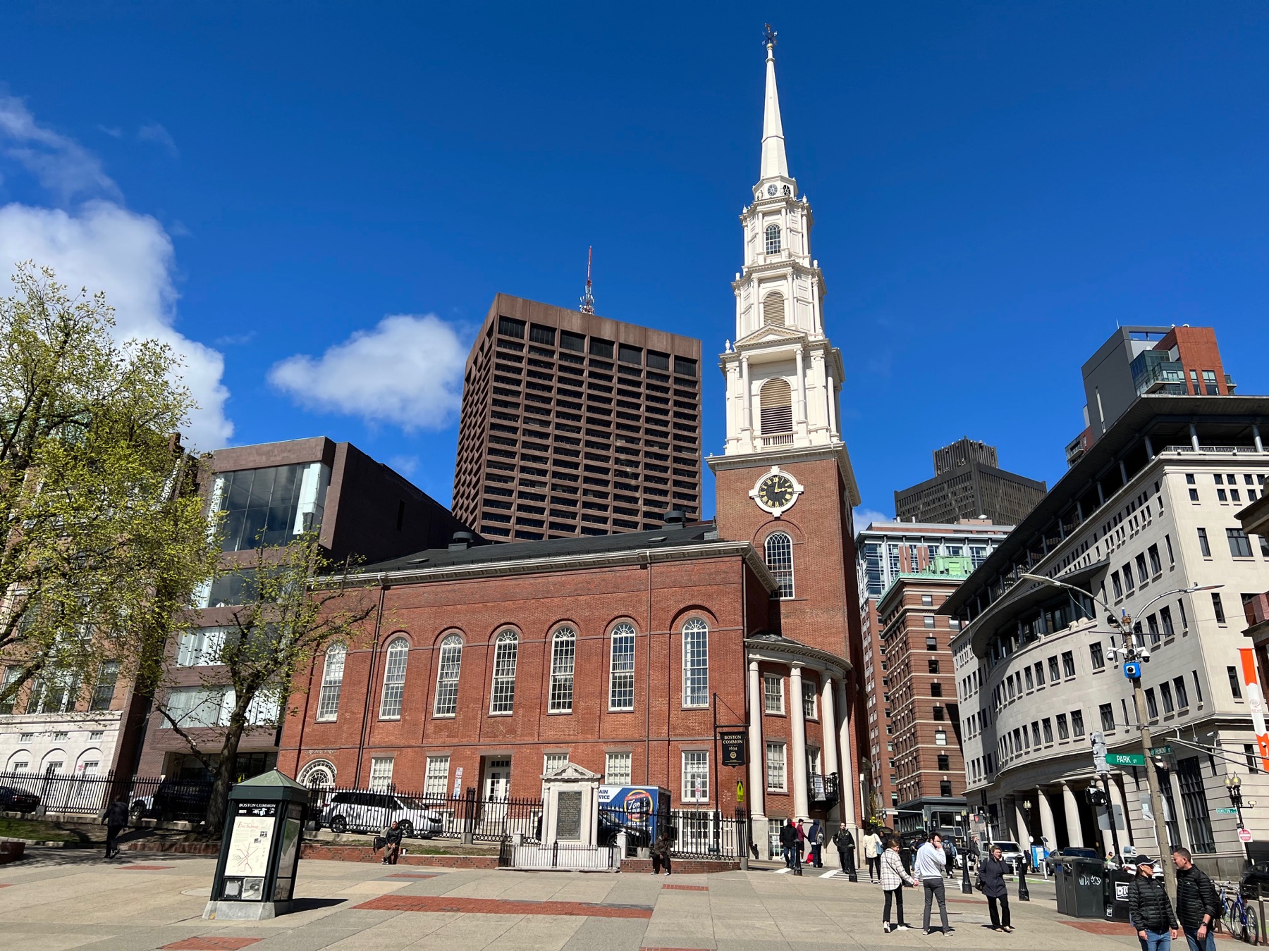 Old South Meeting House with its white steeple rising above downtown Boston