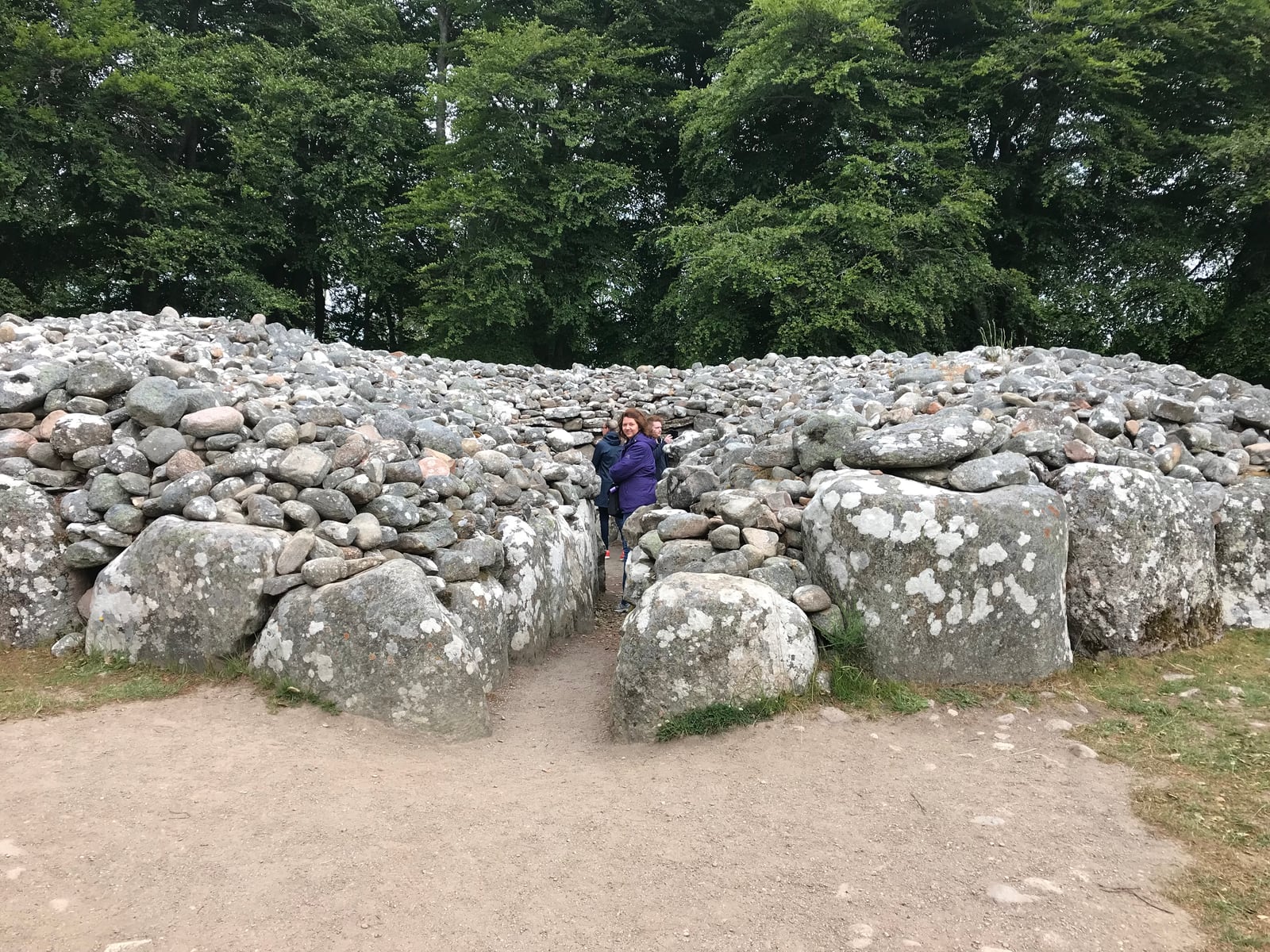 Stone-lined entrance leading into a circular passage grave at Clava Cairns