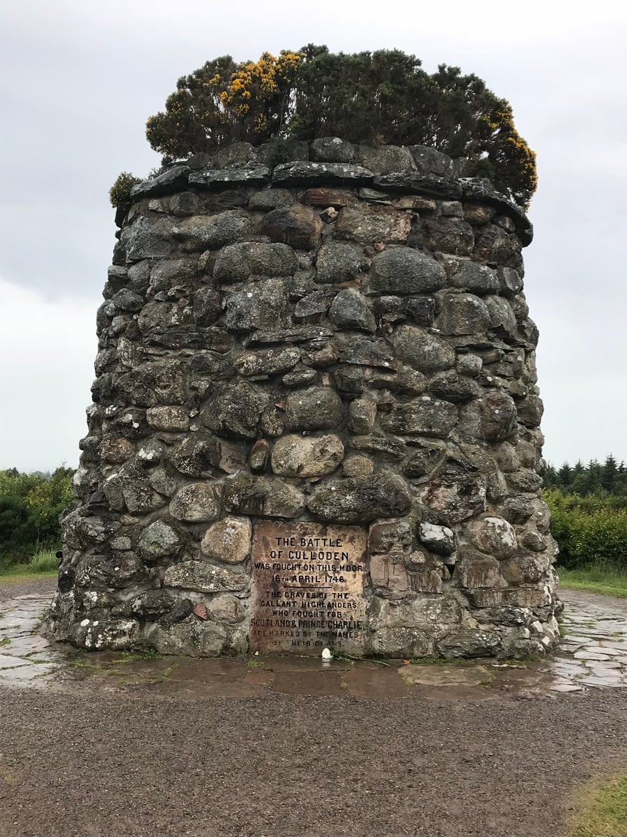 Stone memorial cairn standing on Culloden Battlefield