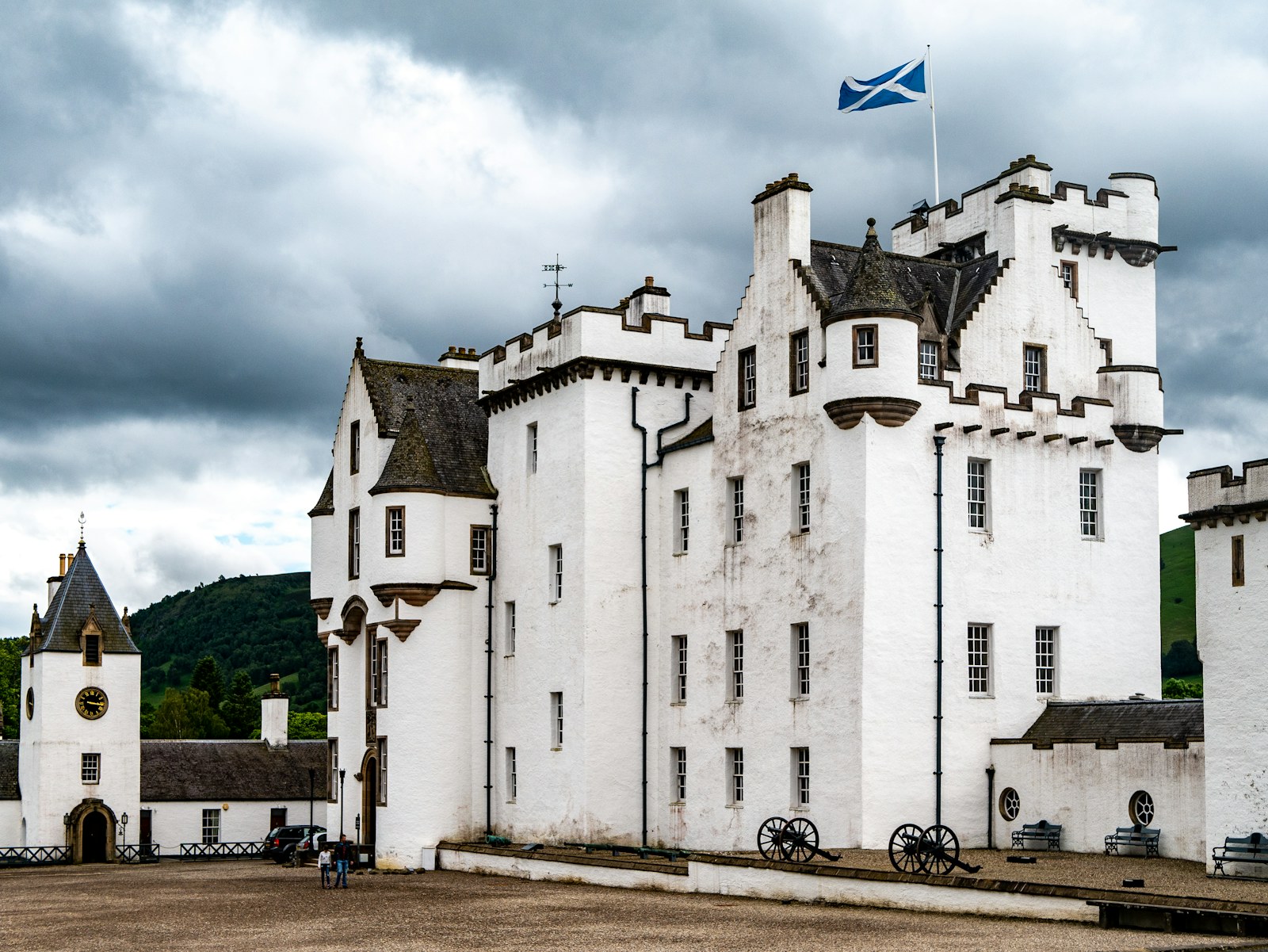 White towers and turrets of Blair Castle beneath a cloudy Scottish sky