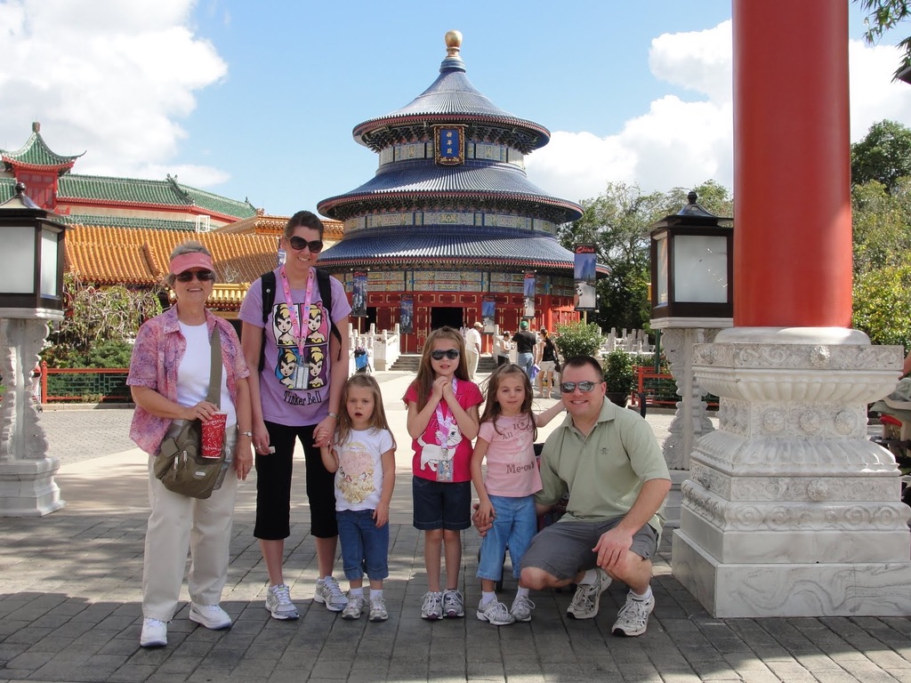 Angie’s family and a grandparent visiting the China pavilion at EPCOT