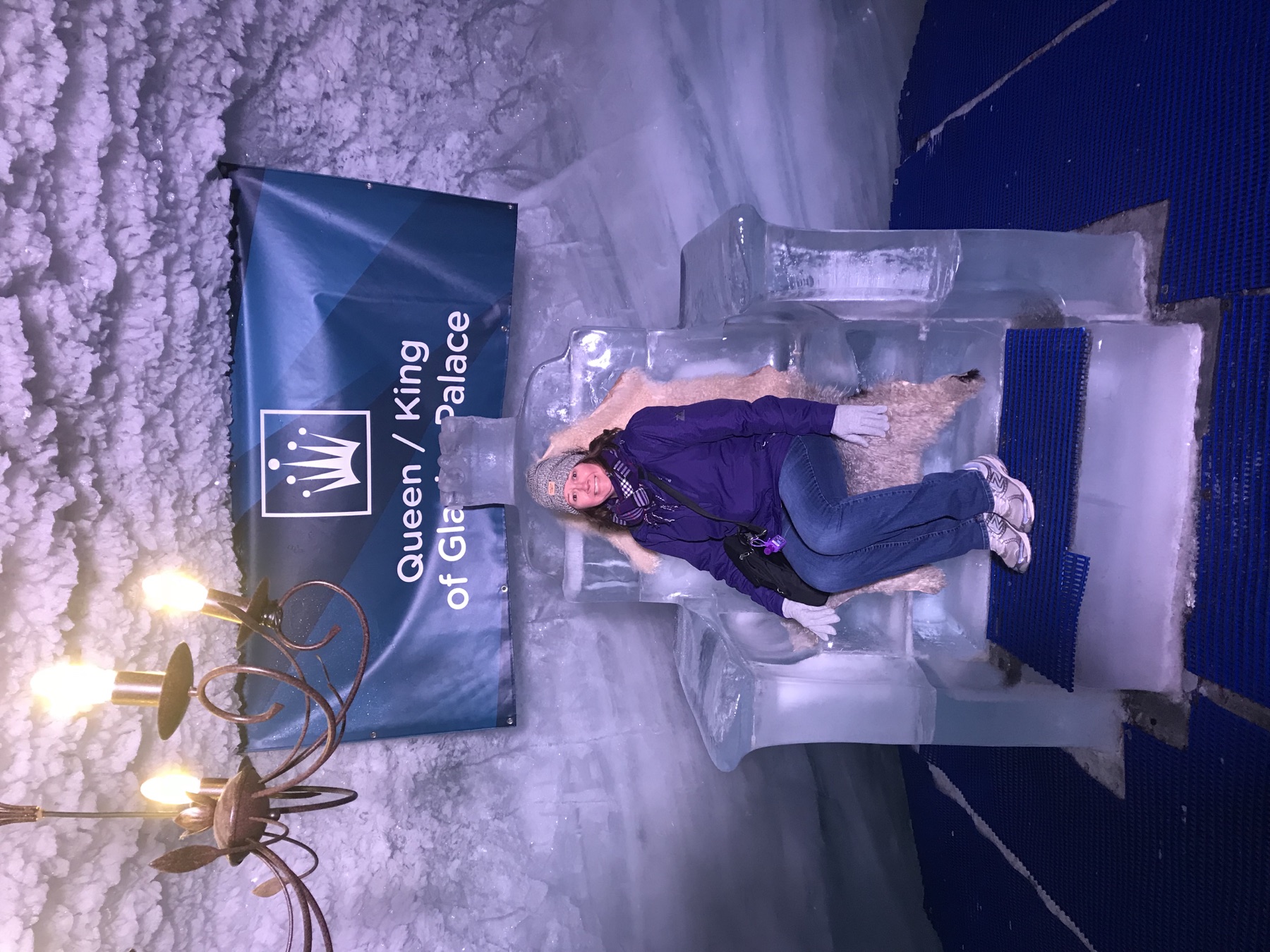 Angela sitting on an ice throne inside the Glacier Palace near the Matterhorn