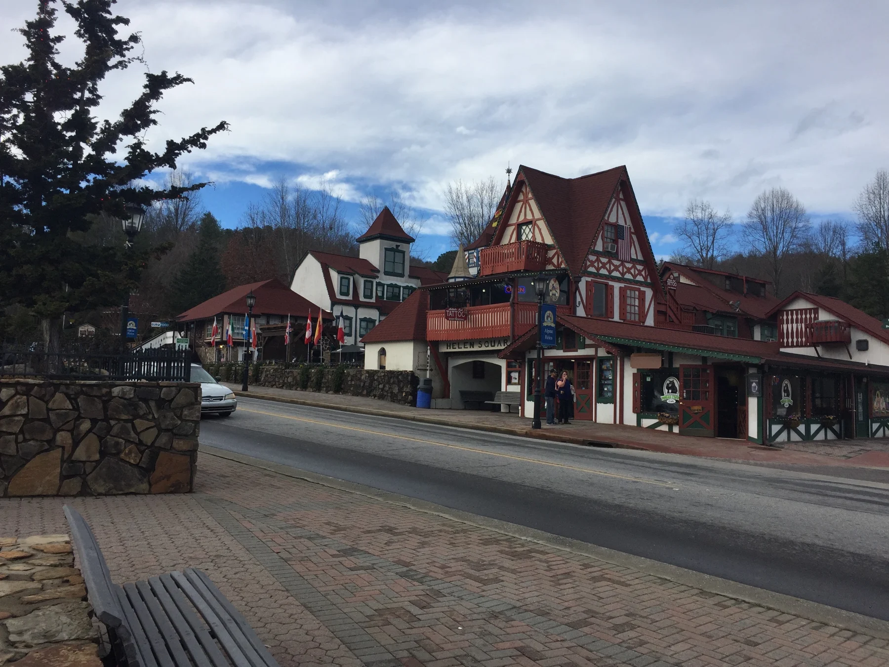 Alpine-style storefronts with steep roofs and decorative timber framing along a street in Helen, Georgia