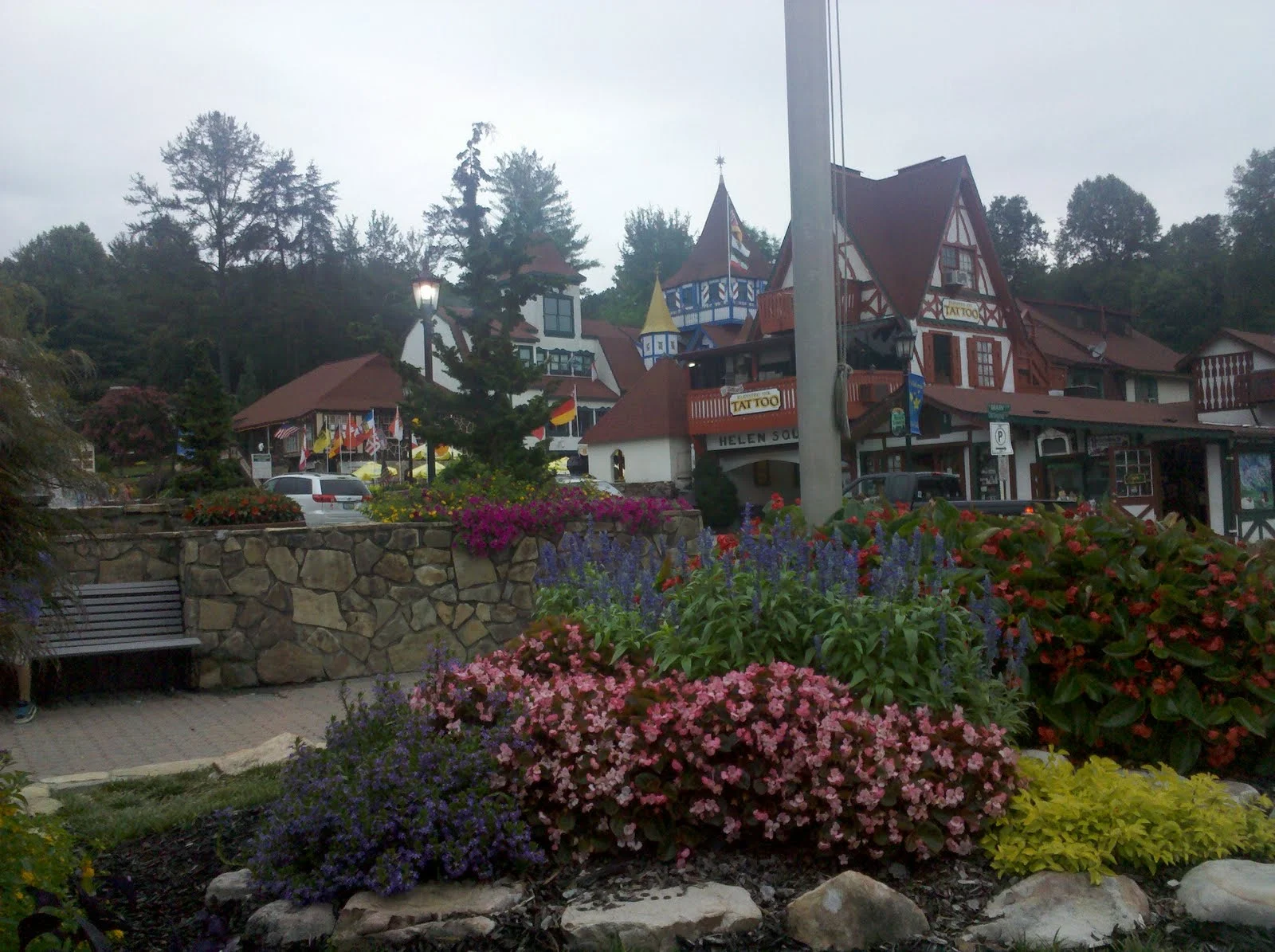 Colorful flower beds and Alpine-style buildings in downtown Helen