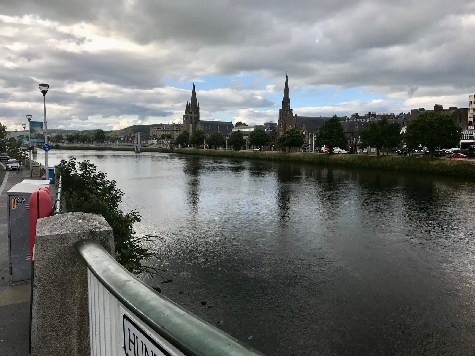 Broad River Ness with church spires and riverside buildings in Inverness