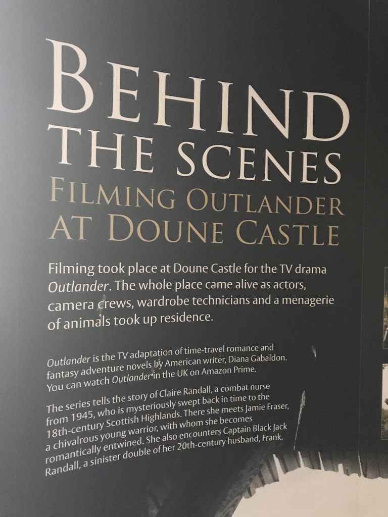 Museum panel titled Behind the Scenes: Filming Outlander at Doune Castle