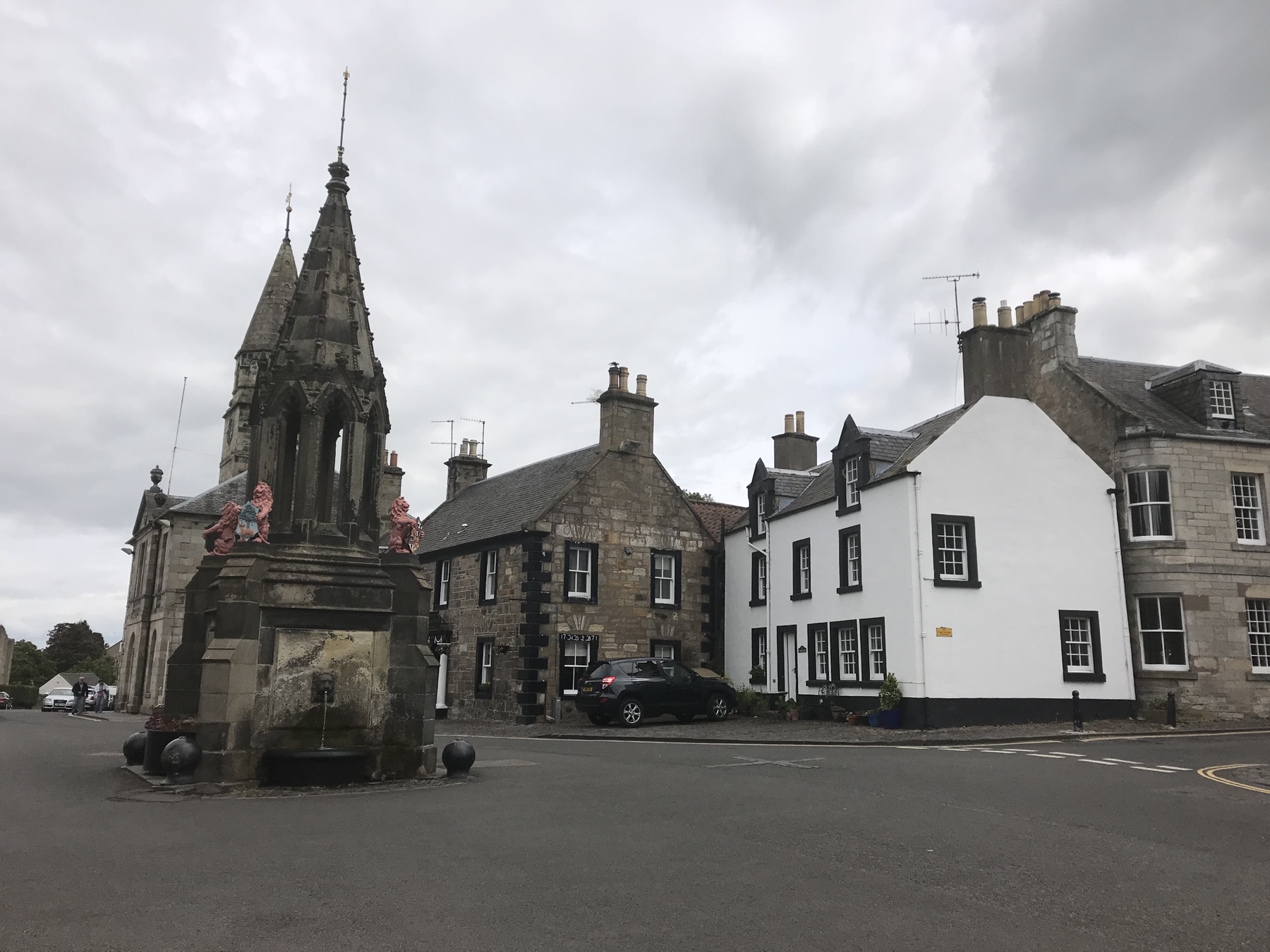 Bruce Fountain, the church, and stone buildings around the village square in Falkland, Scotland
