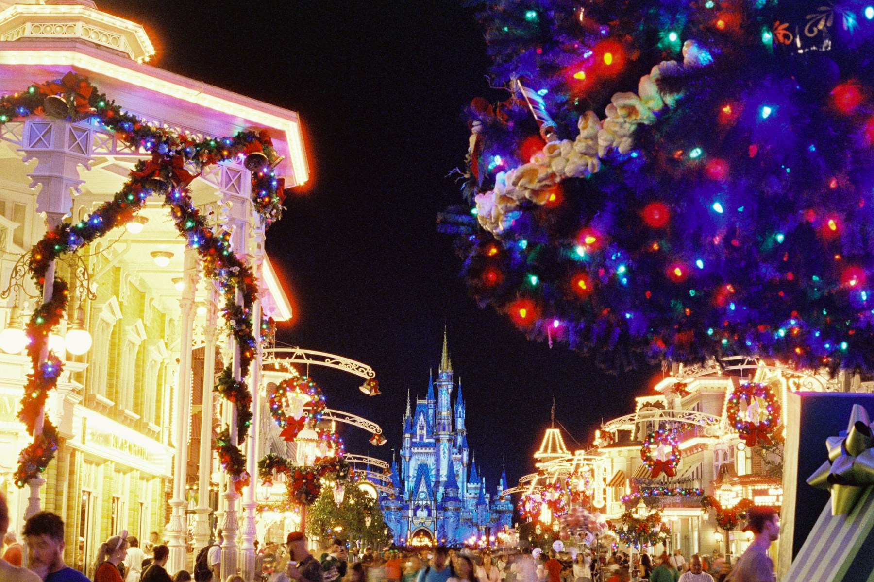 Magic Kingdom at Walt Disney World decorated and illuminated for Christmas