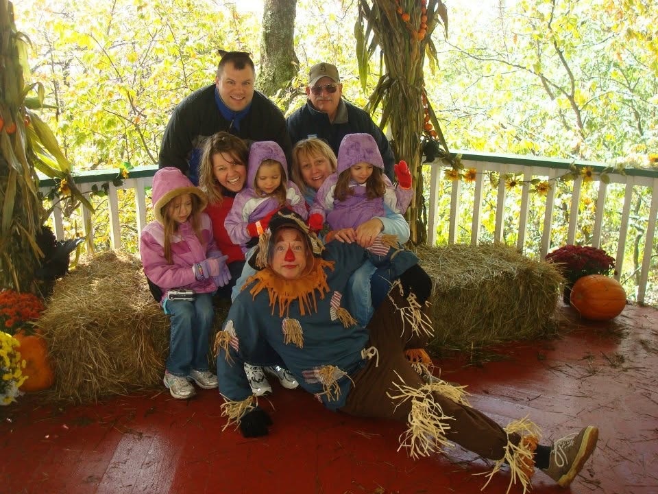Angie’s family meeting the Scarecrow during Autumn at Oz on Beech Mountain, North Carolina
