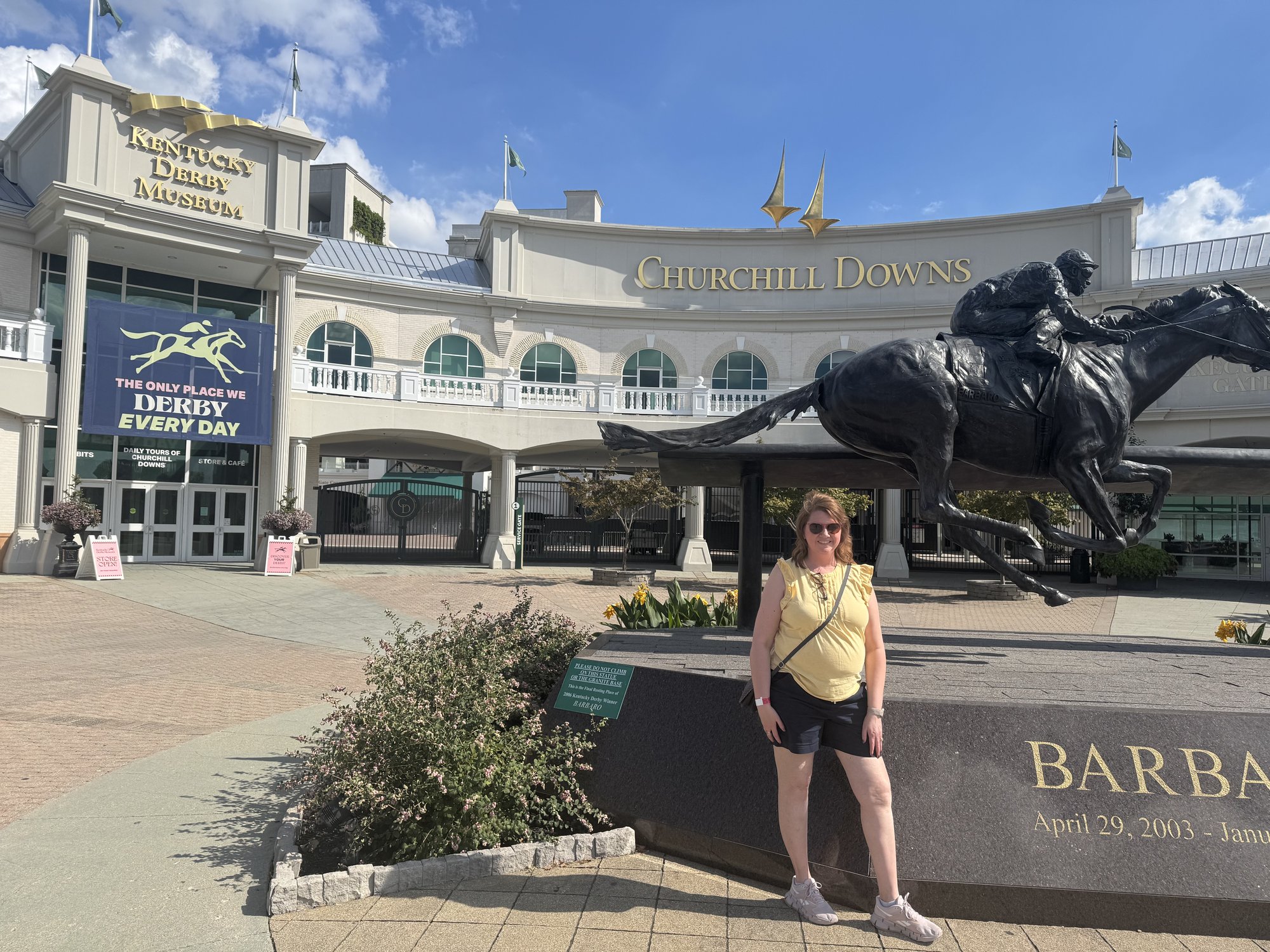 Angela standing outside the Kentucky Derby Museum and Churchill Downs in Louisville
