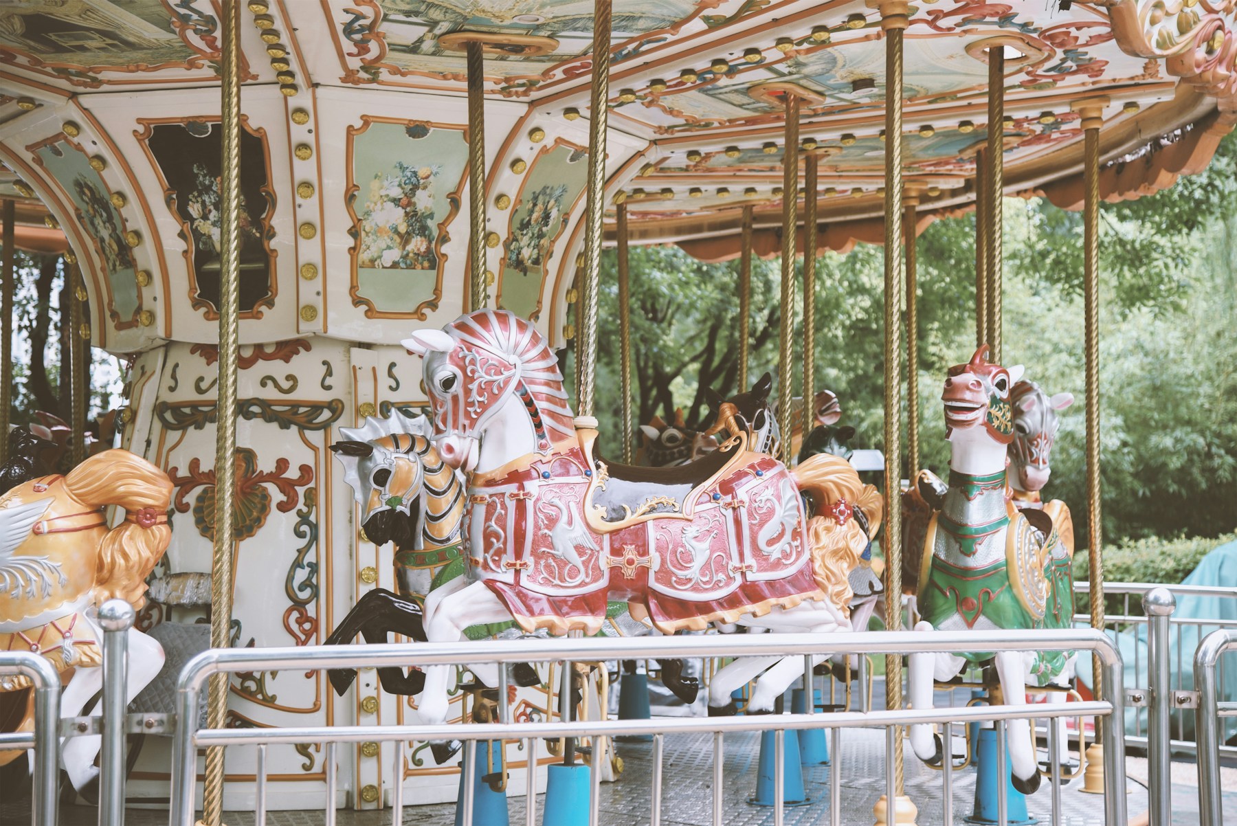 Families riding a traditional carousel at an amusement park