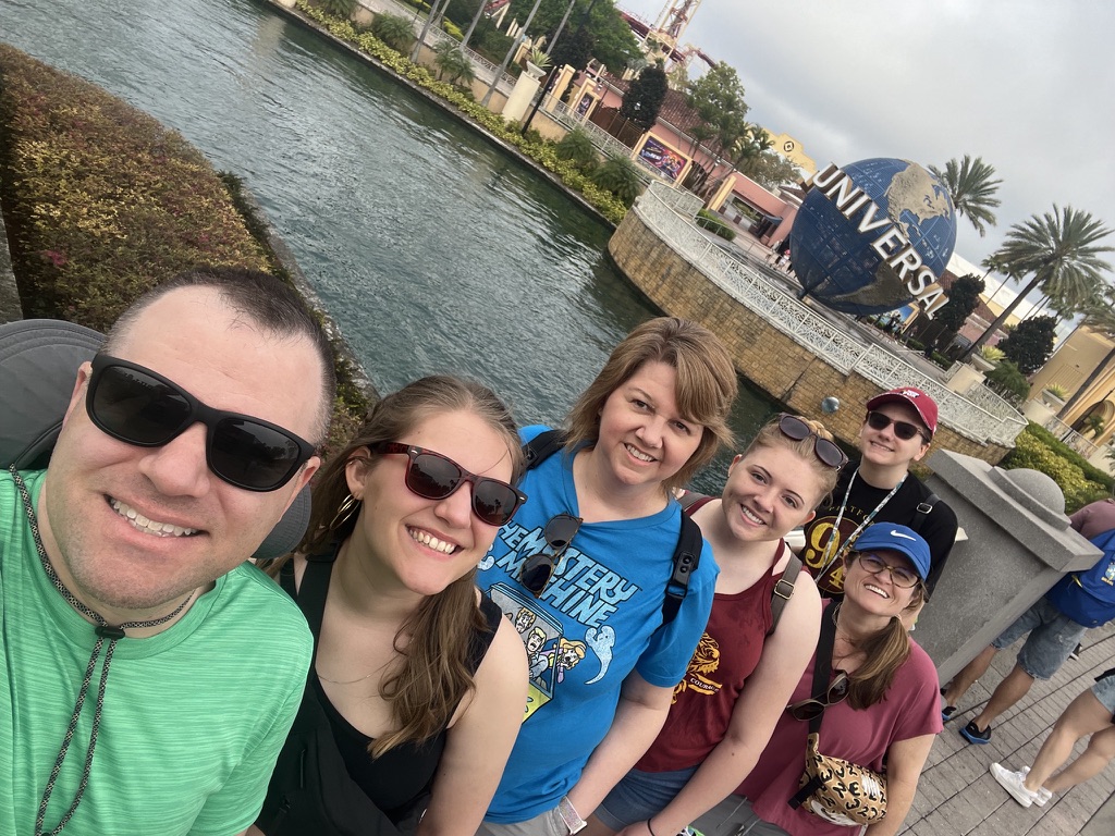 Angie’s family gathered near the Universal Orlando globe