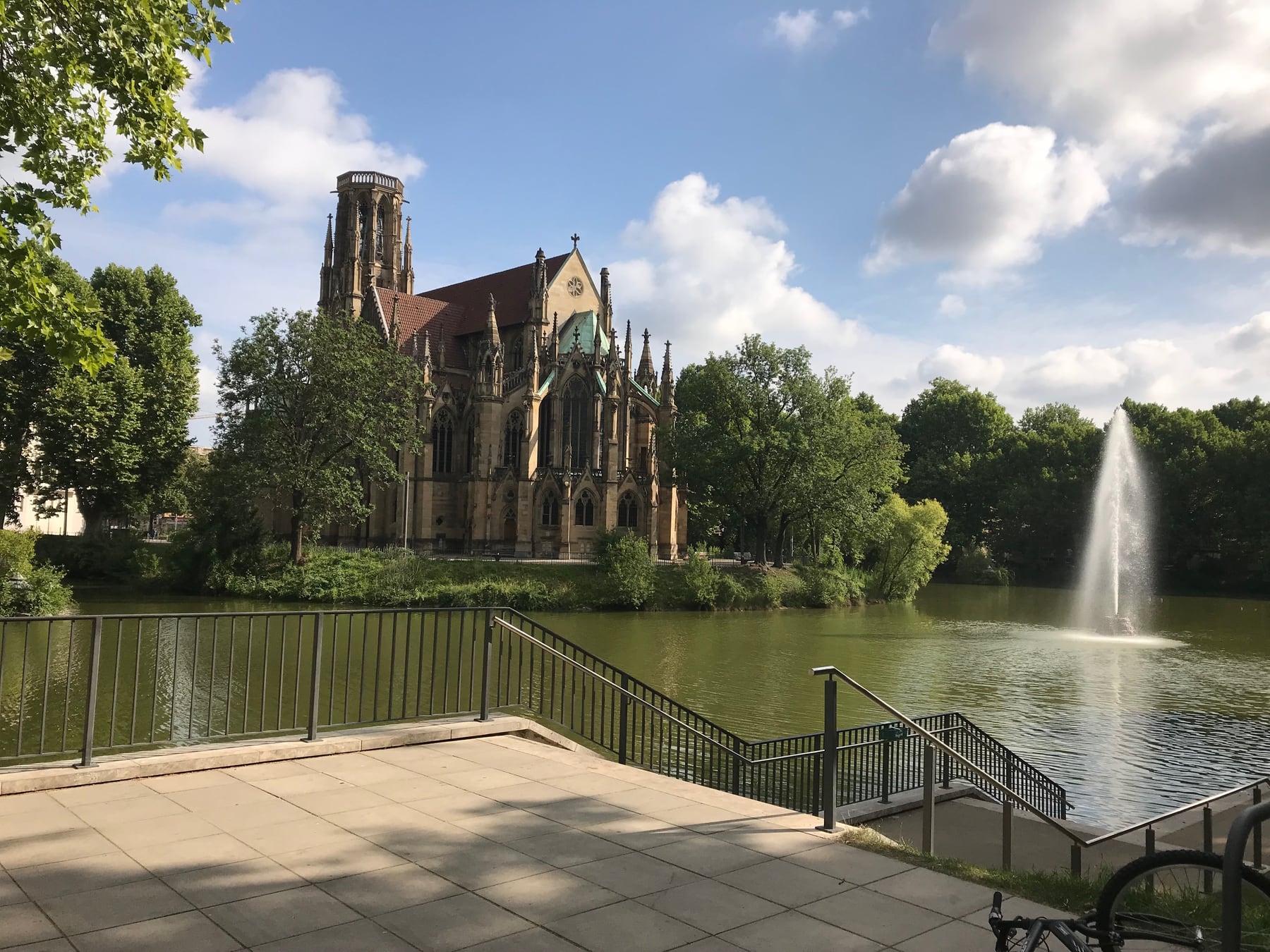 Johanneskirche beside the Feuersee lake and fountain in Stuttgart