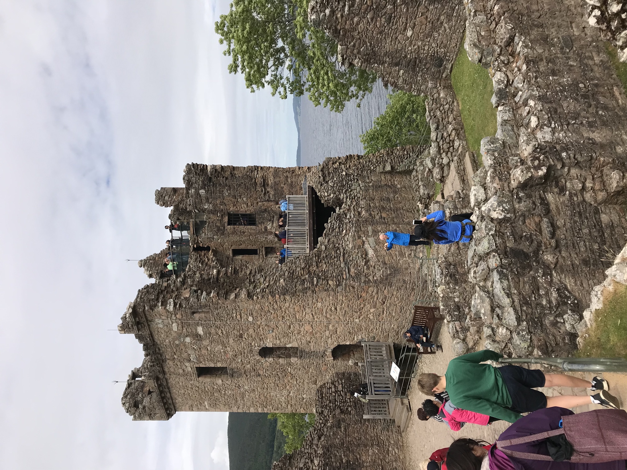 The tall surviving walls and visitor platforms of Grant Tower at Urquhart Castle