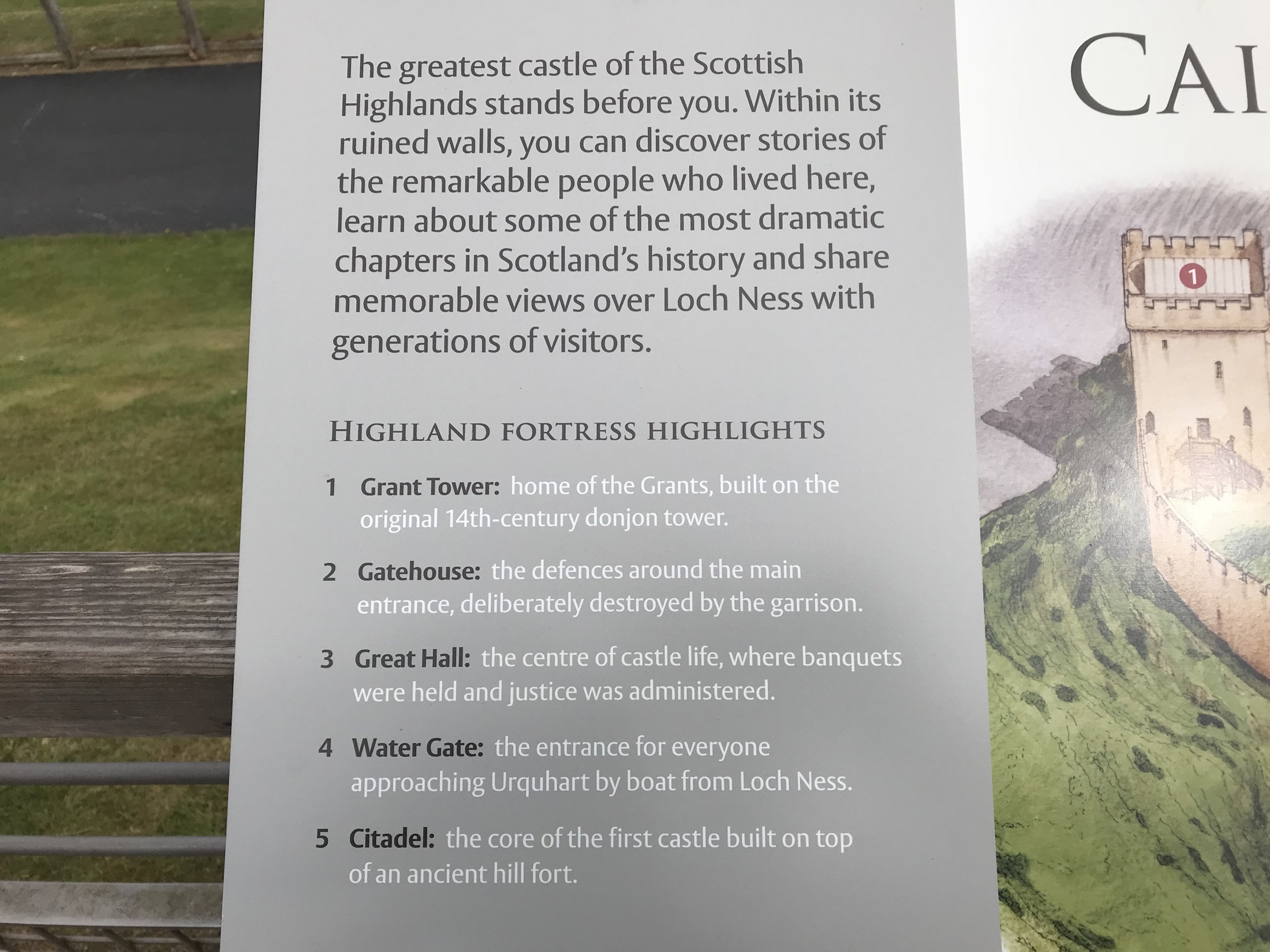An interpretive panel illustrating the former buildings and defenses of Urquhart Castle