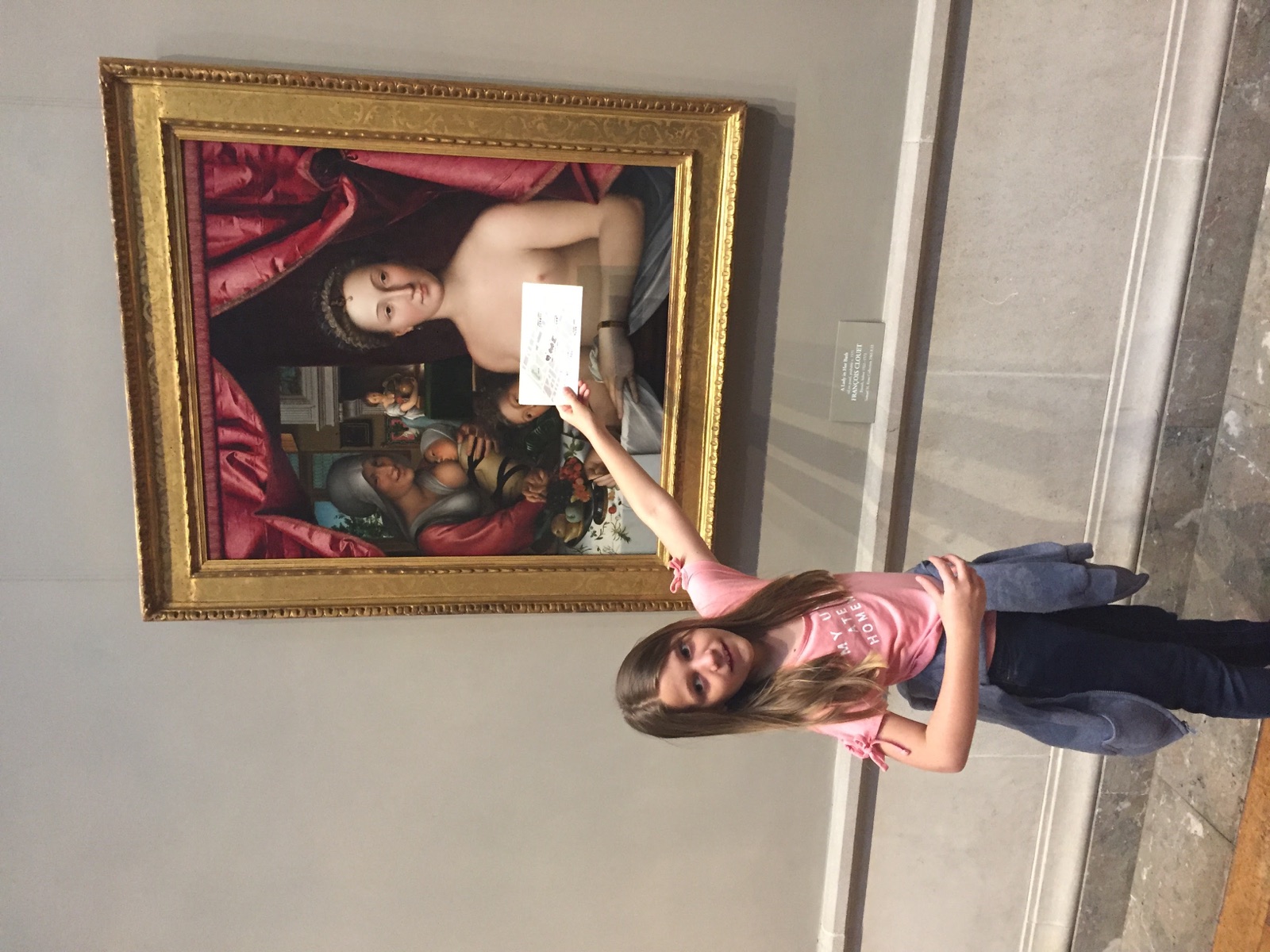 One of Angela’s daughters holding a gallery activity card over the nude figure in François Clouet’s A Lady in Her Bath